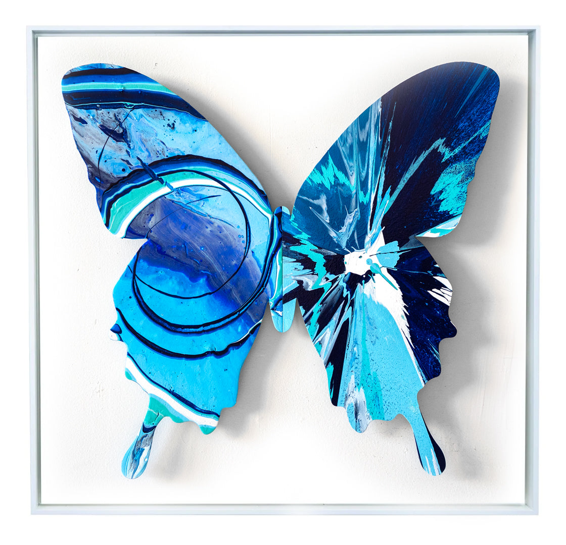 With the butterfly as their canvas, Callen Schaub (left wing) and PunkMeTender  (right wing) created the vibrant azure Alice Blue (34”×34, 2 of 7 in the 2026 Asymmetry Series). Defying expected symmetry, each abstract artist contributes their signature style. 