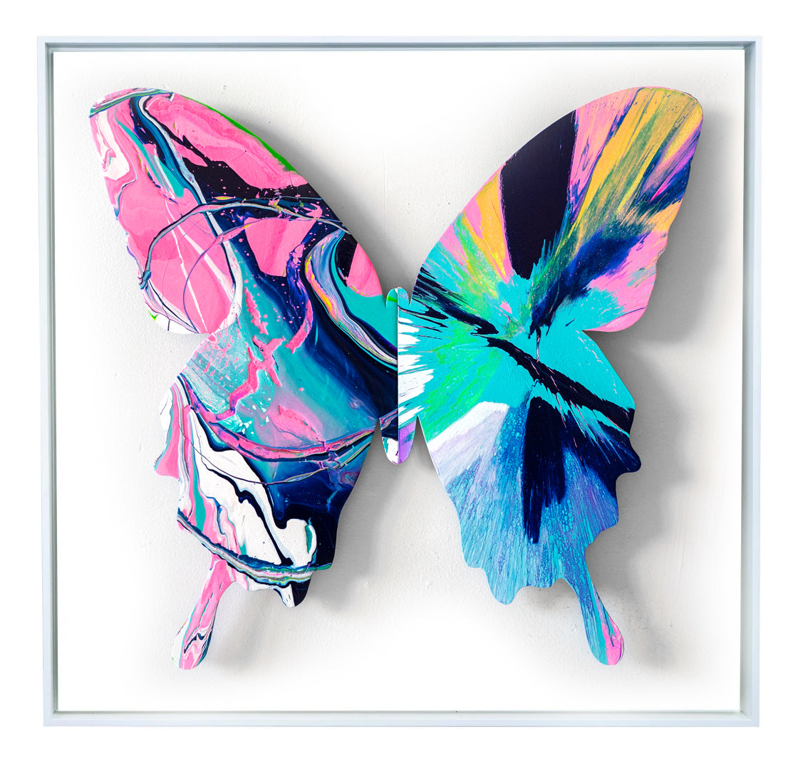 With the butterfly as their canvas, Callen Schaub (left wing) and PunkMeTender (right wing) create the pastel work,Yan Yana (34”×34, 4 of 7 in the 2026 Asymmetry Series). Defying expected symmetry, each abstract artist contributes their signature style. 