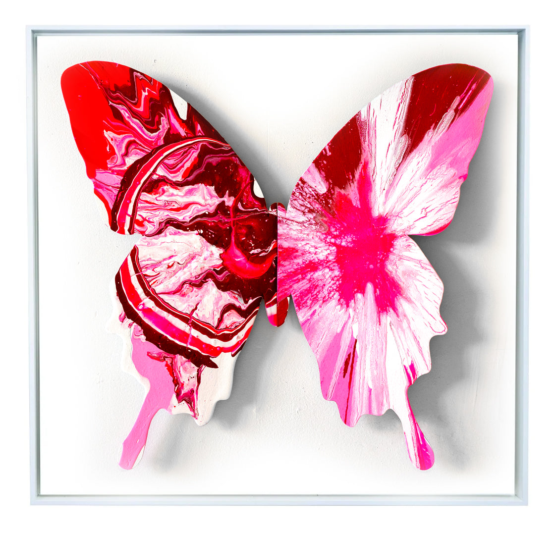 With the butterfly as their canvas, Callen Schaub (left wing) and PunkMeTender  (right wing) created the vibrant red and pink Ebollimento (34”×34, 1 of 7 in the 2026 Asymmetry Series). Defying expected symmetry, each abstract artist contributes their signature style. 
