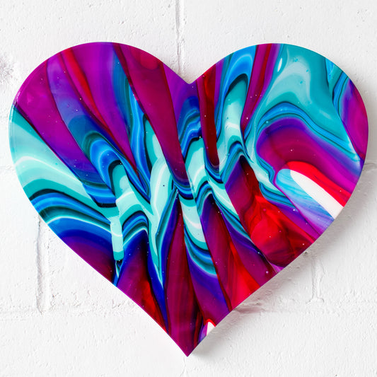 Eternal Love, (20.5” X18”) by abstract artist Callen Schaub, features vibrant multicolored zigzags across a resined, heart canvas. This abstract work is the 14th painting in the artist's After Life Collection.