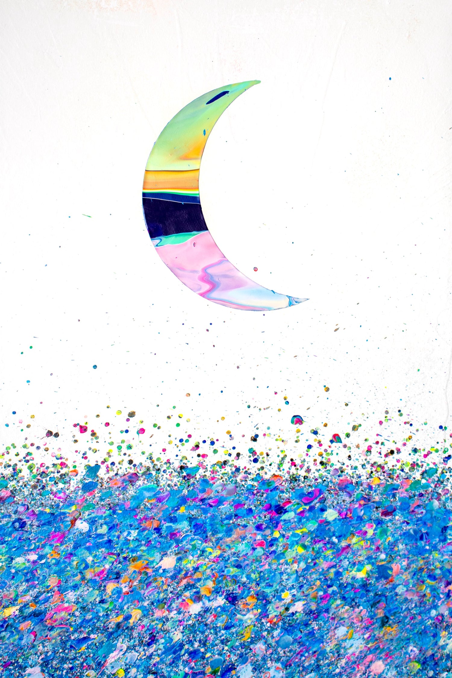  A green and pink waning moon hangs in a pale sky over a sea of tiny blue and pink dots. Callen Schaub’s abstract painting, Bitmoon, was created using a stencil, a bicycle-powered spinner and an original splatter technique called “confetti-pop.”